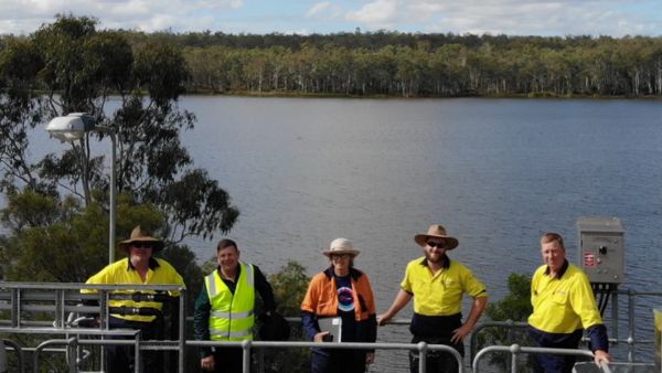 Regional Water Quality Engineers at a water treatment plant and dam